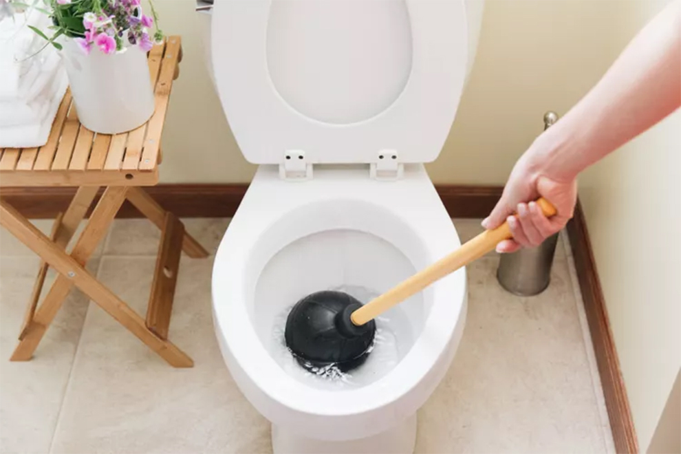 fix a clogged toilet without a plunger